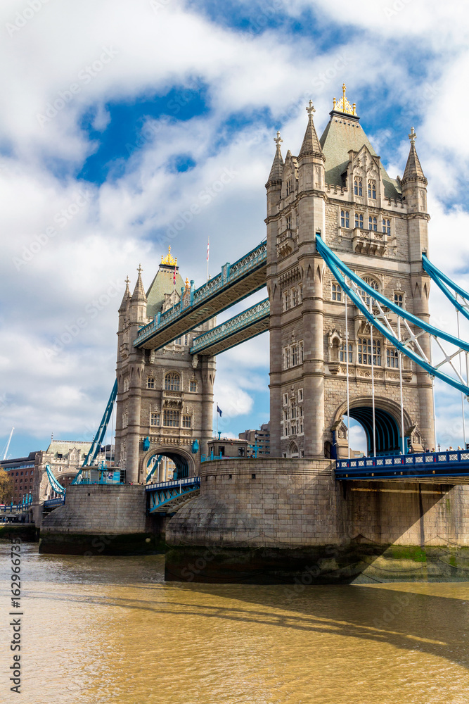 Obraz premium Tower Bridge in London, the UK. Sunset with beautiful clouds. Drawbridge opening. One of English symbols