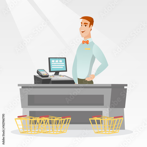 Cashier standing at the checkout in a supermarket.