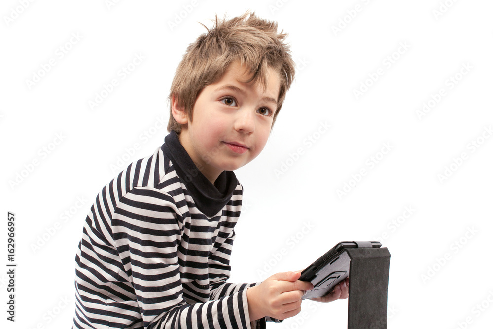 Geek boy holding a tablet in an unhealthy position Geek boy holding a tablet in an unhealthy position