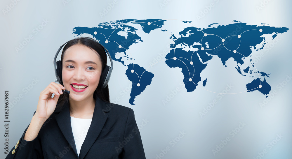 Beautiful asian woman smiling customer service talking on headset with world map communication. Business concept, Elements of this image furnished by NASA