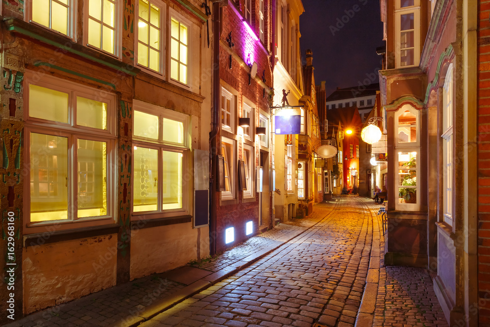 Medieval Bremen street Schnoor with half-timbered houses in the centre of the Hanseatic City of Bremen at night, Germany Medieval Bremen street Schnoor with half-timbered houses in the centre of the Hanseatic City of Bremen at night, Germany