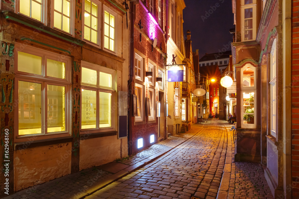 Medieval Bremen street Schnoor with half-timbered houses in the centre of the Hanseatic City of Bremen at night, Germany