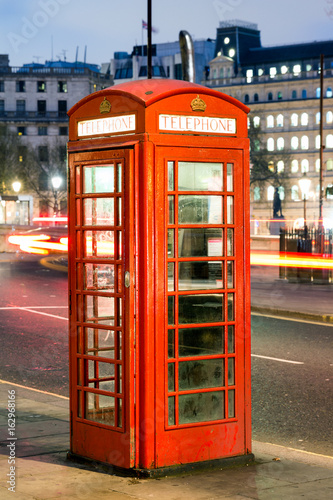 London Telephone box at night with streaming vehicle headlights