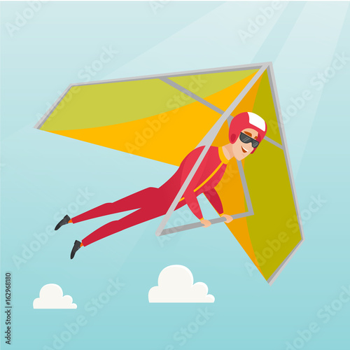 Young caucasian man flying on hang-glider.