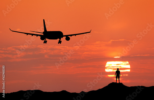 Airplane and silhouette of ...