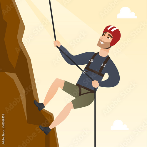 Young caucasian man climbing a mountain with rope.