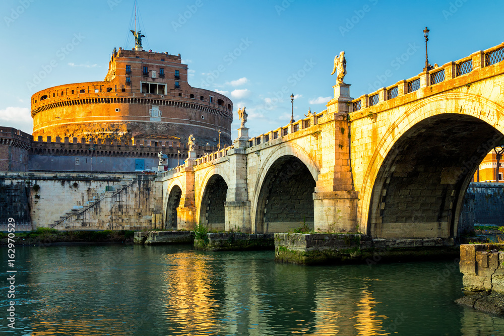 The Mausoleum of Hadrian, usually known as the Castle of the Holy Angel (Castel Sant Angelo) and Ponte Sant'Angelo bridge, a towering cylindrical building in Parco Adriano, Rome, Italy