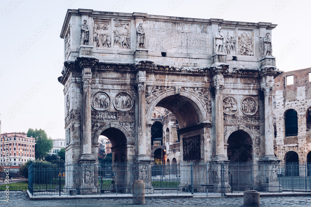 Arch of Constantine and coliseum in background at Rome, Italy