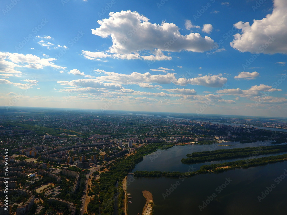 Fototapeta premium Aerial view. Houses and river in the city Dnepr, Ukraine.