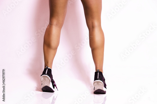 Woman with beautiful muscular calf muscles closeup 
