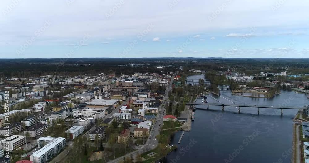 Joensuu, Cinema 4k aerial rising view of joensuu cityscape and pielisjoki river, on a spring day, in Karelia, Finland Joensuu, Cinema 4k aerial rising view of joensuu cityscape and pielisjoki river, on a spring day, in Karelia, Finland