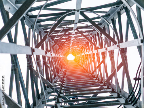 Looking up through tunnel of Telecommunication tower, Way of success concept 