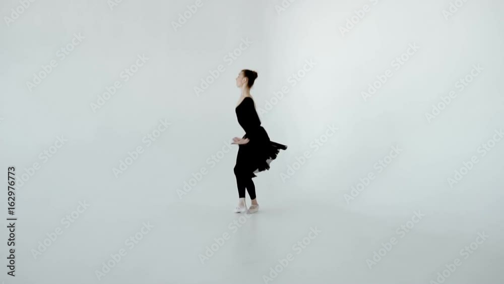 20s Ballerina in white pointe and black dress jumps beautifully and gracefully lands slow motion 120fps. 20s Ballerina in white pointe and black dress jumps beautifully and gracefully lands slow motion 120fps.