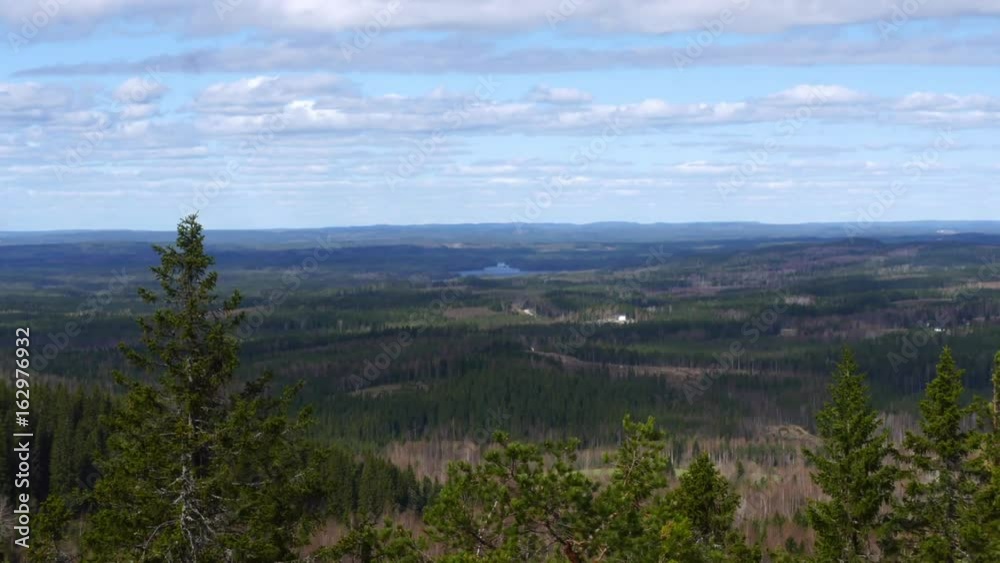Koli, Time lapse view of sun sailing on fields and forrests in koli national park, on a spring day, in Lieksa, Karelia, Finland Koli, Time lapse view of sun sailing on fields and forrests in koli national park, on a spring day, in Lieksa, Karelia, Finland