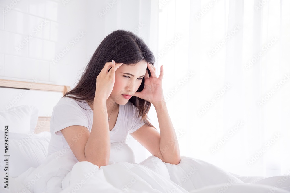 Beautiful asian woman having headache in morning Beautiful asian woman having headache in morning