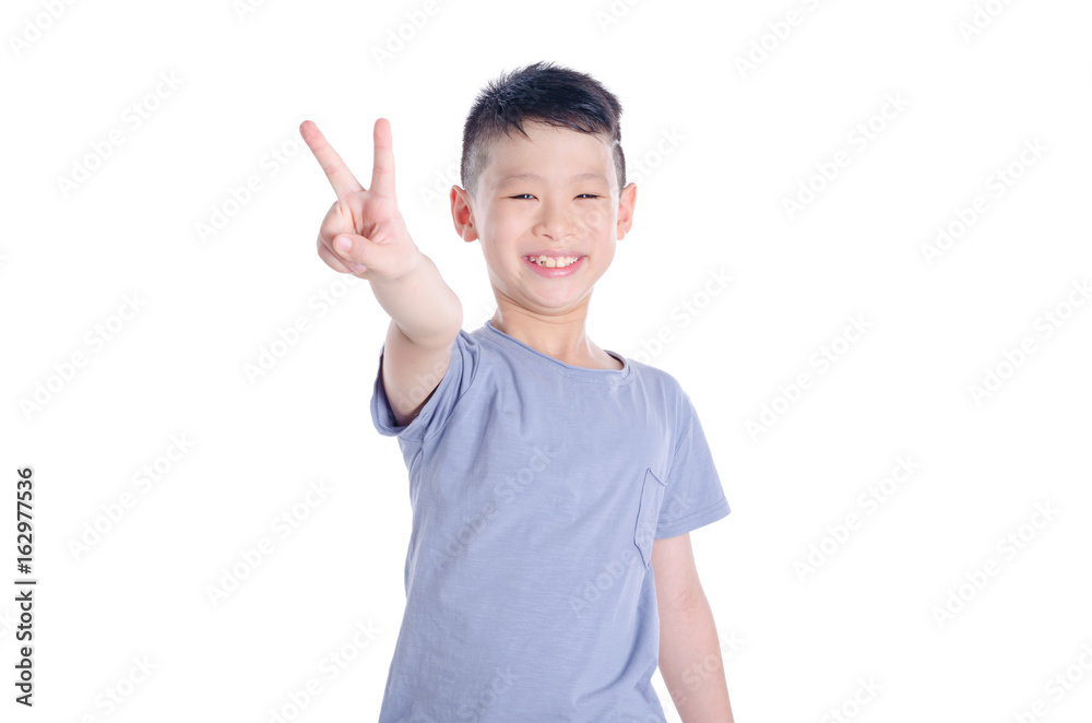 Young asian boy smiling over white background Young asian boy smiling over white background