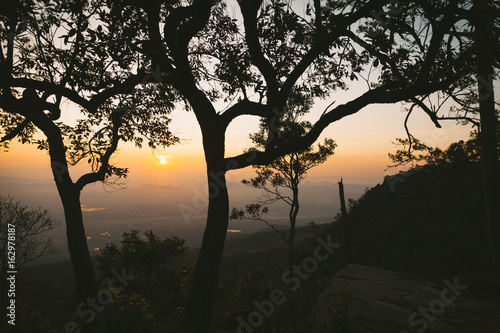The sunrise scene with forest and mountain in Phu Kradueng National Park, Thailand.