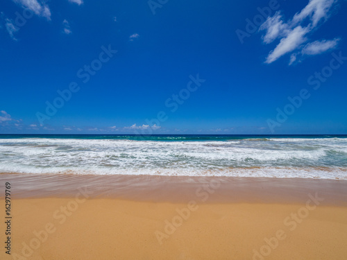 Blue Sky  Golden Sand and Waves  Kealia Beach  Kapaa  Kauai  Hawaii  USA