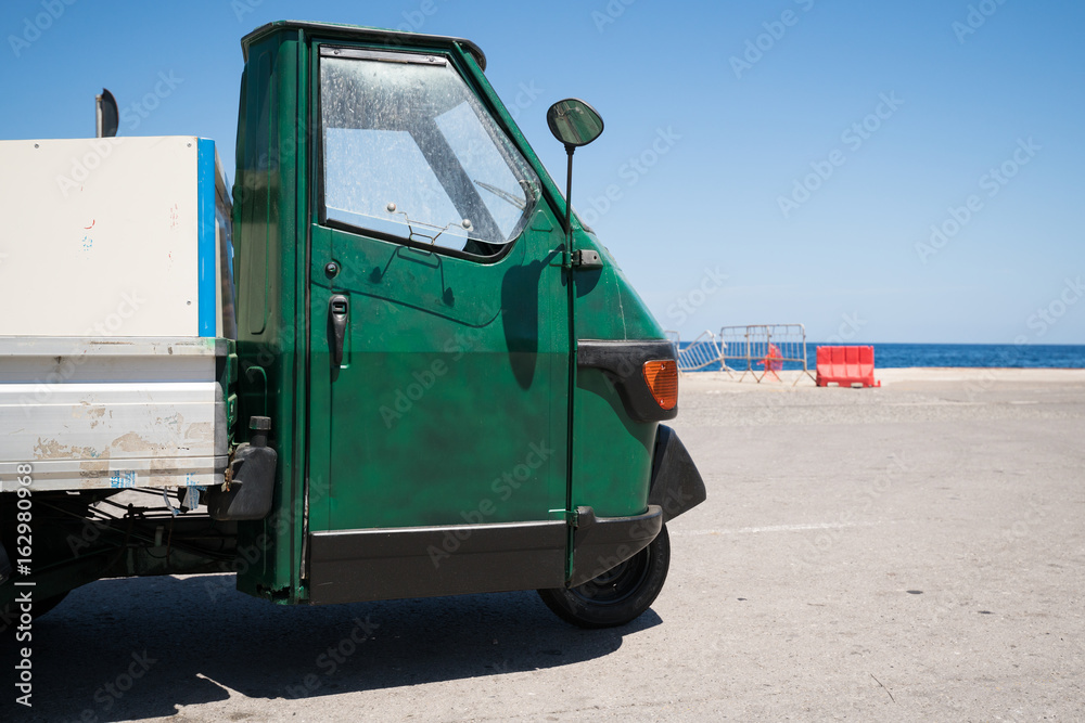 Fototapeta premium Compact three wheeled car for commercial purposes