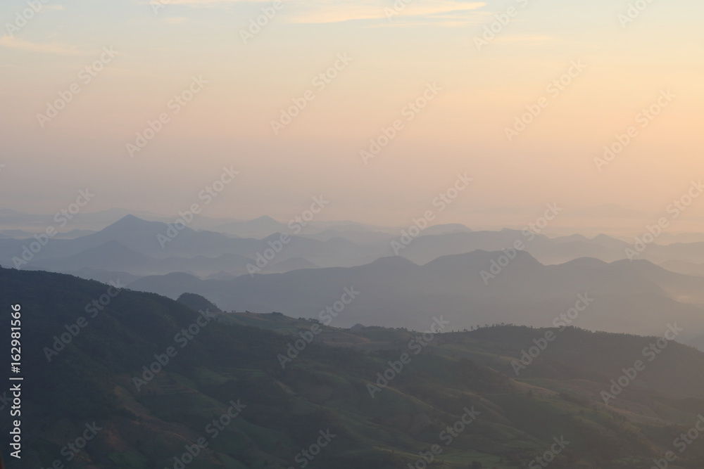 Beautiful sunrise view in the mountains landscape at Lon Noi Cliff in Phurua National Park, Loei, Thailand.