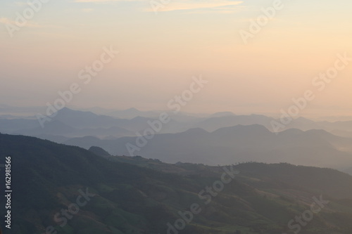 Beautiful sunrise view in the mountains landscape at Lon Noi Cliff in Phurua National Park, Loei, Thailand.