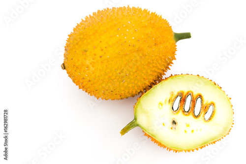 Gac Fruit Or Baby Jackfruit / Gac Fruit Or Baby Jackfruit With Half Cross Section On Wooden Background. photo