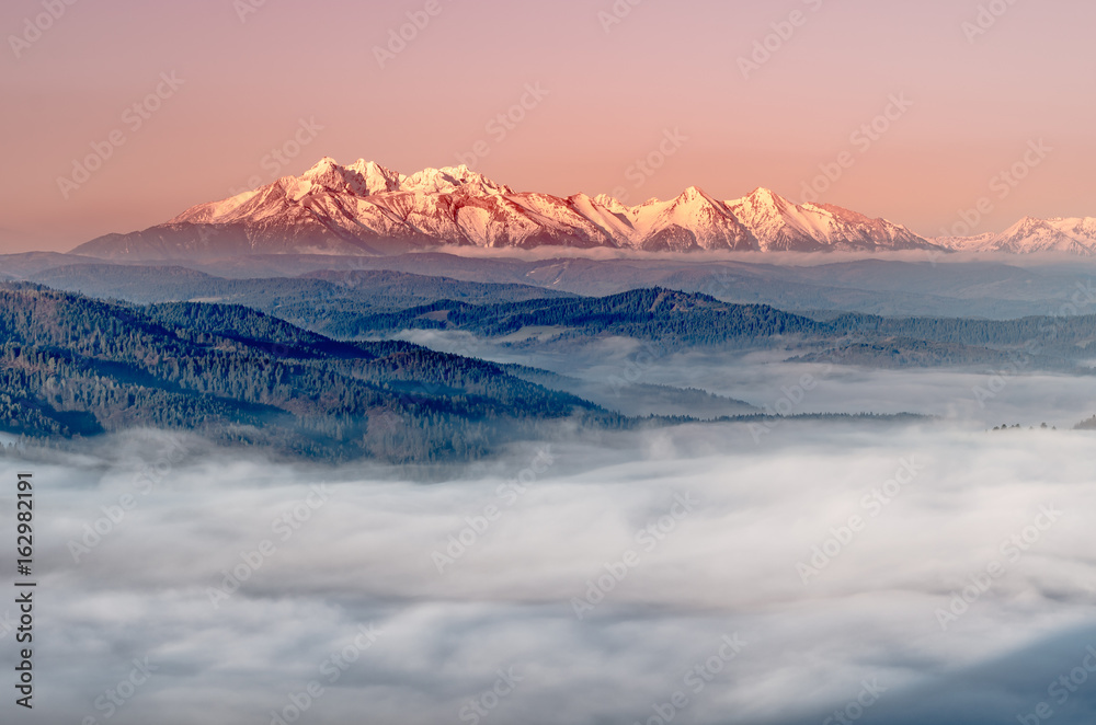 panorama over misty Spisz highland to snowy Tatra mountains in the morning, Poland and Slovakia landscape - obrazy, fototapety, plakaty 
