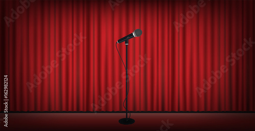 microphone stand on stage red curtain background