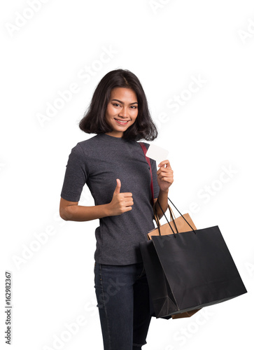 Beautiful woman with shopping bags and card on whir background