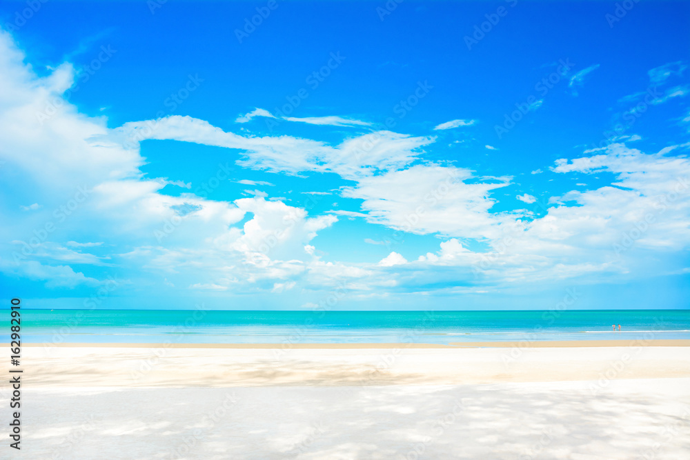 Beautiful white sand beach in summer blue sky background