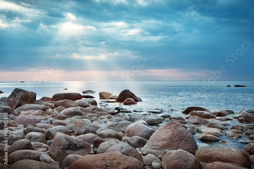 Fototapeta Naklejka Na Ścianę i Meble -  Rocky shores at the sea in sunset light. Lahemaa natural park coastal landscape with beautiful sky