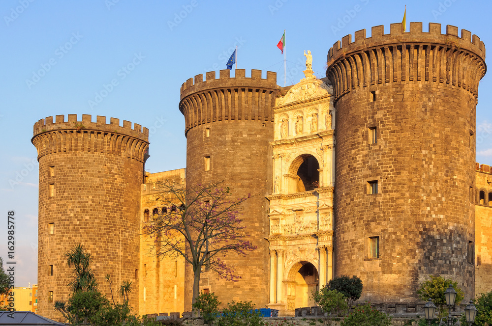 The imposing towers and triumphal arch of the New Castle Castel Nuovo - Naples, Campania, Italy