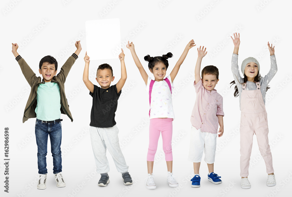 Naklejka premium Little Kids Together Show Blank Paper Copy Space Studio Portrait Isolated
