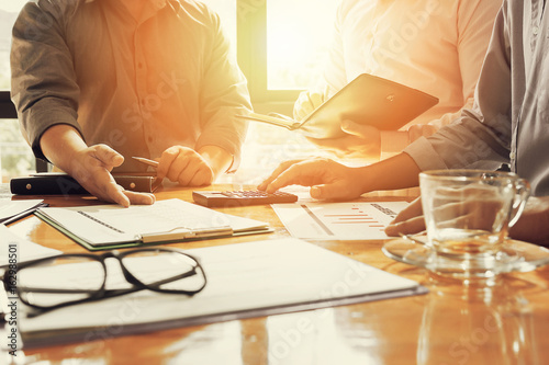 Administrator business man financial inspector and secretary making report, calculating or checking balance.