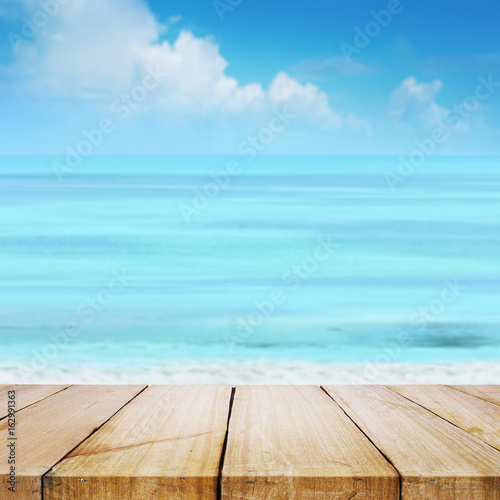 Close up wood with blurred sea sky background, summer day, copy space or for product.