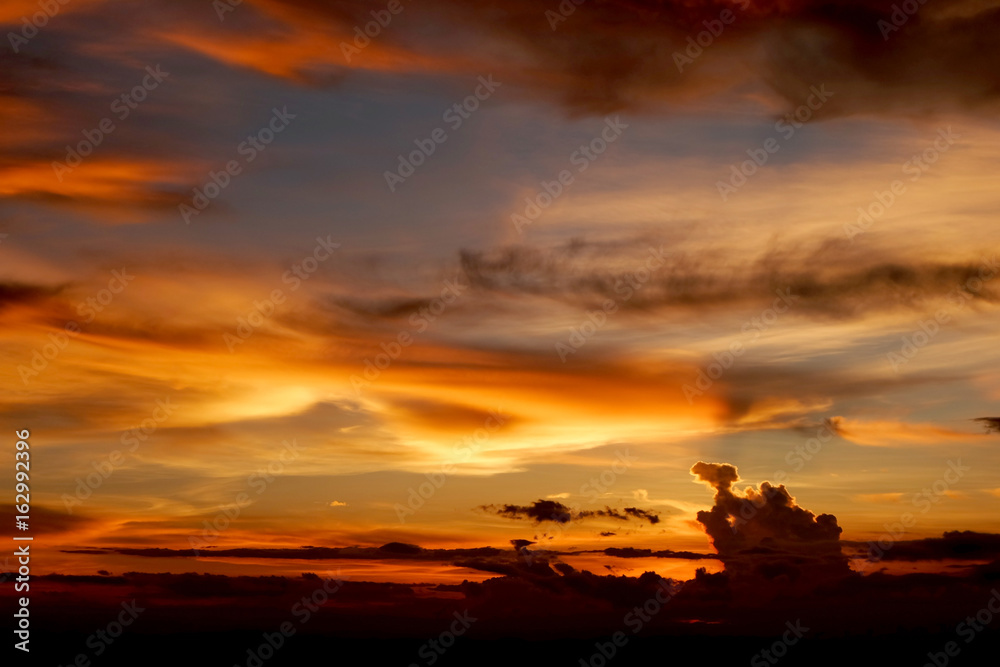 The beautiful sunset sky and color clouds over mountains