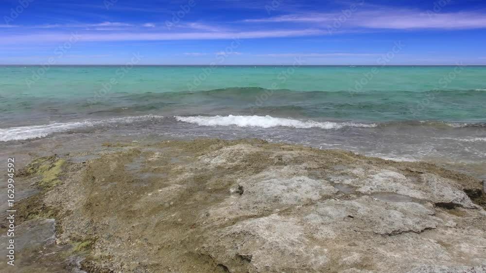 Balearic Ibiza Formentera turquoise beach with very small waves, 4 K video Balearic Ibiza Formentera turquoise beach with very small waves, 4 K video