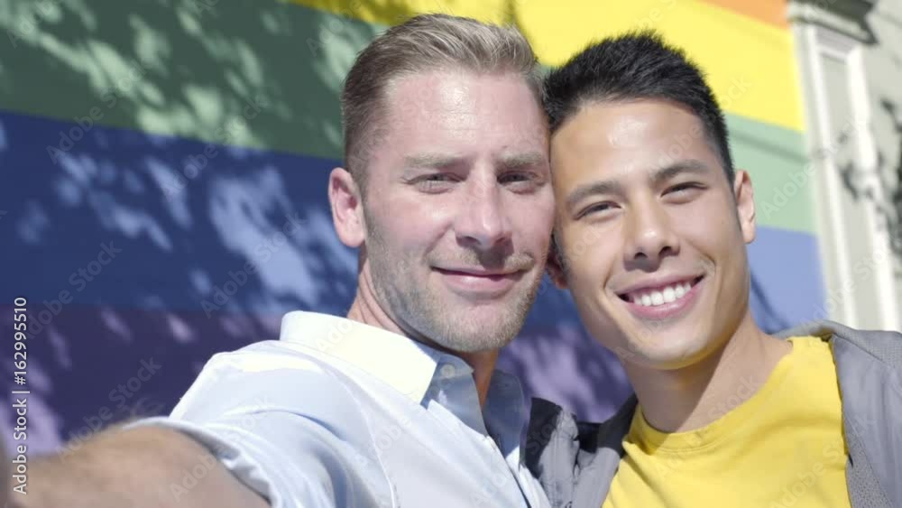 Attractive Gay Couple Kiss On Cheek And Pose For Selfie In Front Of Gay attractive-gay-couple-kiss-on-cheek-and-pose-for-selfie-in-front-of-gay