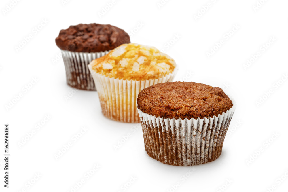 Cherry, lemon and apple cupcakes isolated on a white background