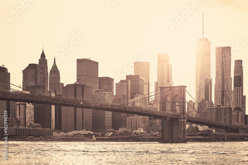 Fotografiet Manhattan at sunset, sepia toning applied, New York City, USA.