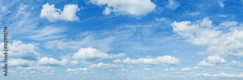 Sunny blue sky backgrond with clouds Panorama Photo