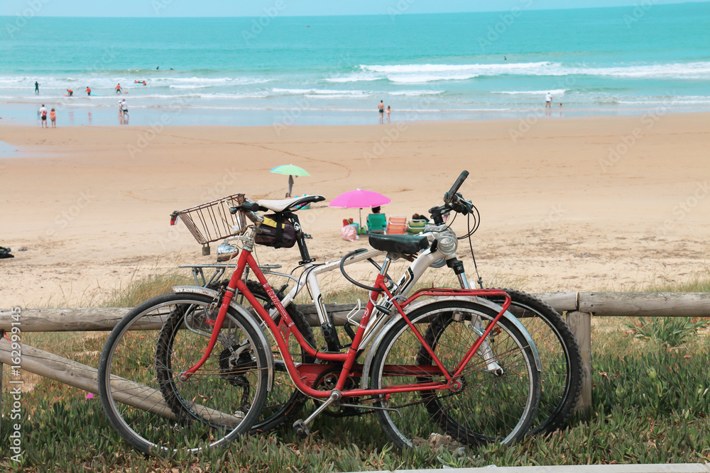 Fototapeta premium Bicycles on the beach of El Palmar, Spain