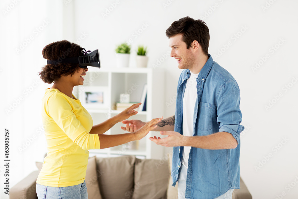 happy couple with virtual reality headset at home happy couple with virtual reality headset at home