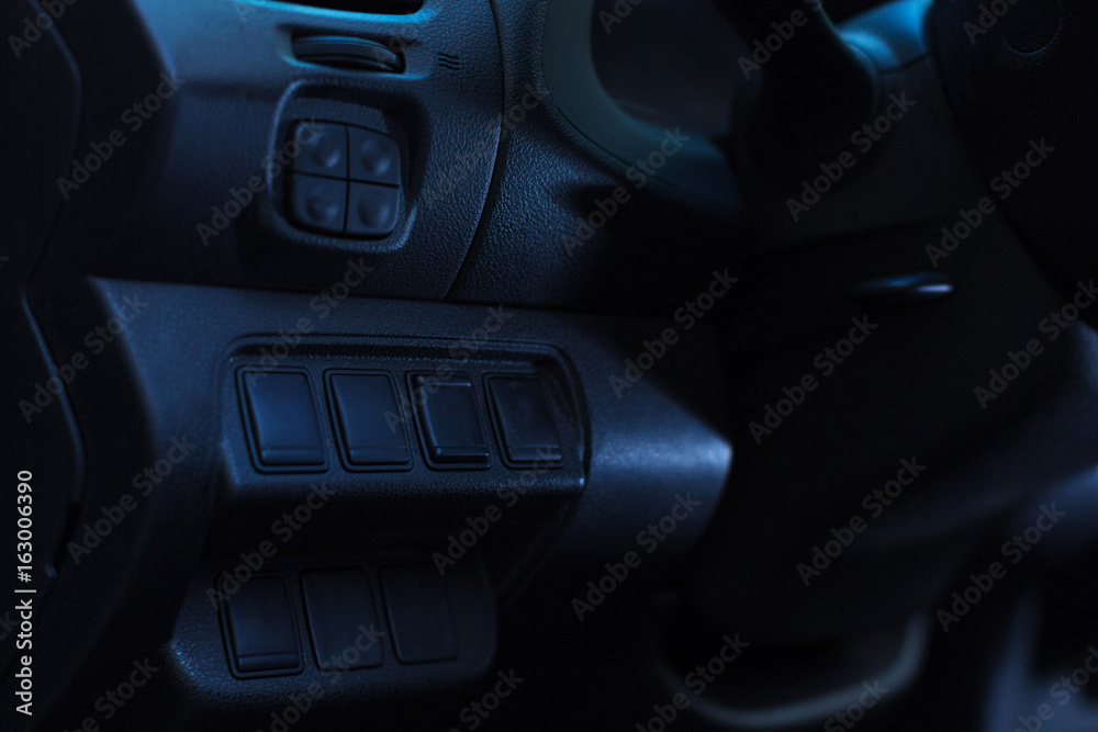 Close up of numerous controls of a car head unit