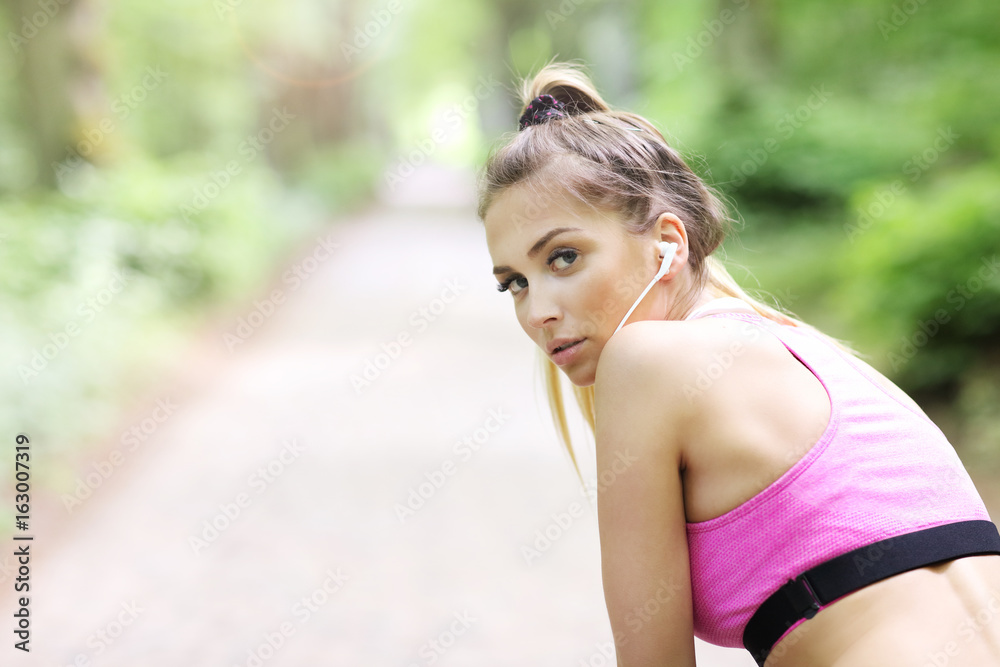 Exhausted woman jogging in the forest Exhausted woman jogging in the forest