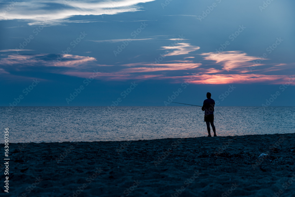 Angler in the beach