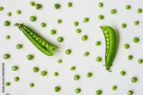 Green peas on a white background. 