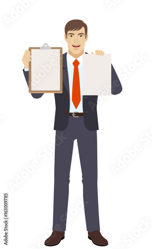 Businessman holding the clipboard and paper