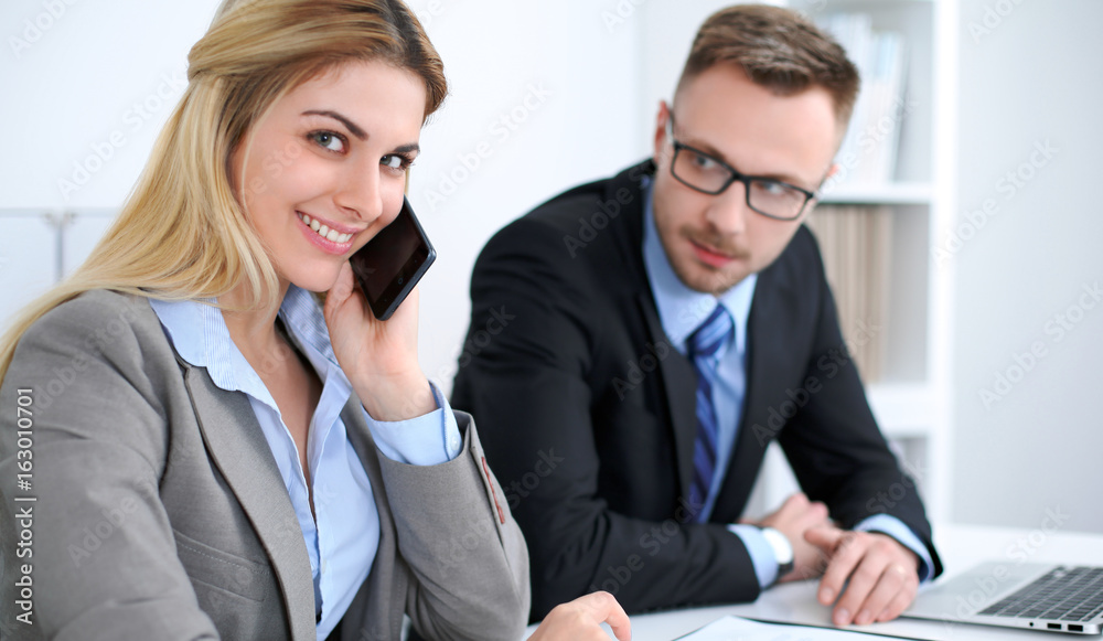 Successful business people working at meeting in office background