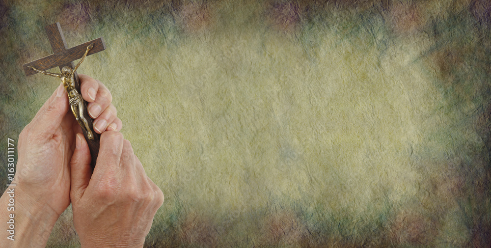 Fotografie A Message from Christ  Parchment Background - Female hands holding a Corpus Chri